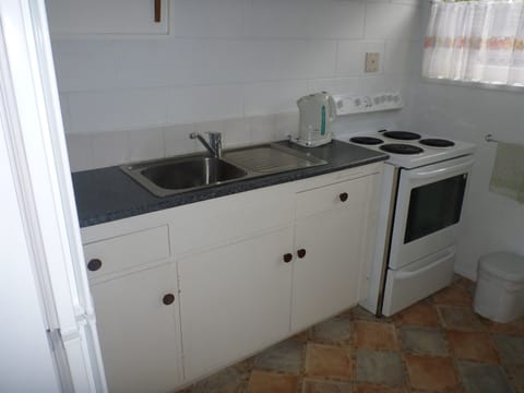 Apartment, 2 Bedrooms | Private kitchen | Mini-fridge, microwave, stovetop, cookware/dishes/utensils