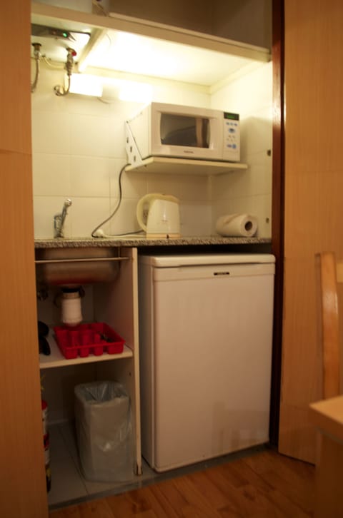 Fridge, microwave, electric kettle, cookware/dishes/utensils