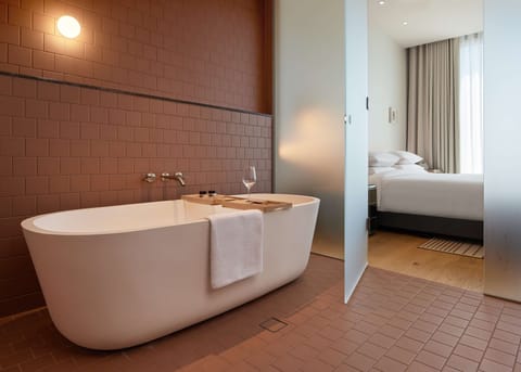 King Suite | Bathroom | Designer toiletries, hair dryer, bathrobes, slippers