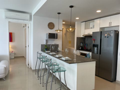 Panoramic Apartment | Private kitchen | Full-size fridge, microwave, oven, stovetop