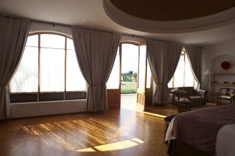 Grand Studio Suite, Pool View | Iron/ironing board, free WiFi, bed sheets