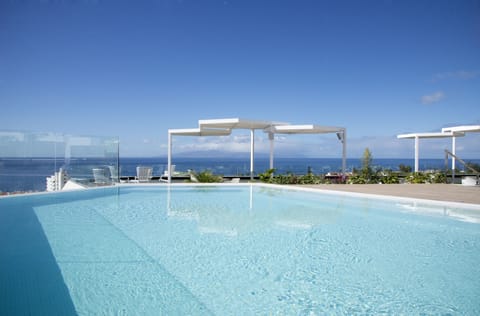 2 outdoor pools, open 8:00 AM to 7:00 PM, pool umbrellas, sun loungers