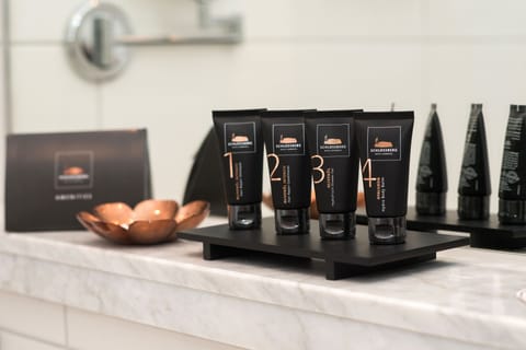 Shower, designer toiletries, hair dryer, slippers