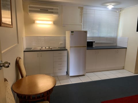 Executive Apartment, 1 King Bed, Kitchenette, Garden View | Private kitchen | Microwave, highchair, freezer