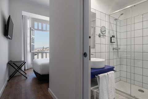 Deluxe Double Room, Sea View | In-room safe, blackout drapes, soundproofing, iron/ironing board