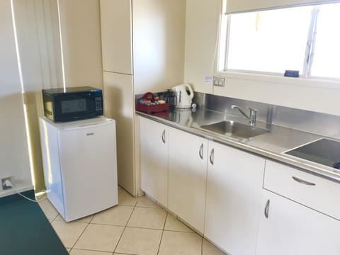 Family Apartment, 1 Bedroom | Private kitchen | Mini-fridge, microwave, electric kettle, toaster