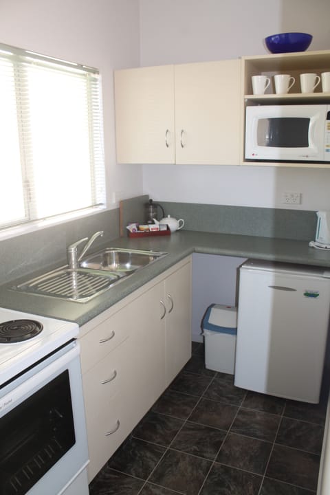 Deluxe Two Bedroom | Private kitchen | Fridge, microwave, coffee/tea maker, electric kettle