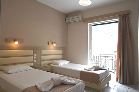 Double or Twin Room, Partial Sea View | Desk, iron/ironing board, free WiFi, bed sheets