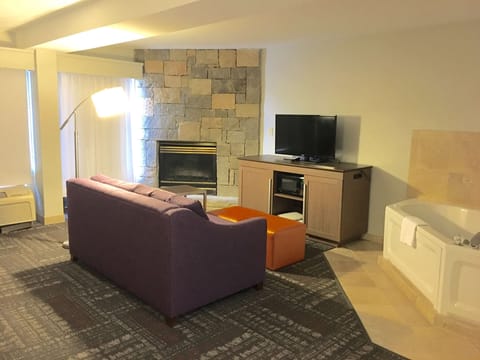 Suite, 1 King Bed, Non Smoking, Fireplace | Living area | 37-inch TV with cable channels