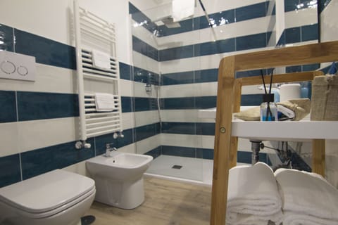 Exclusive Double Room, Accessible, Garden View (Ligea) | Bathroom | Shower, rainfall showerhead, free toiletries, hair dryer