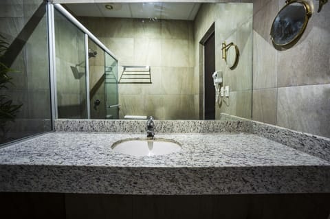 Superior Room | Bathroom | Shower, rainfall showerhead, hair dryer, towels