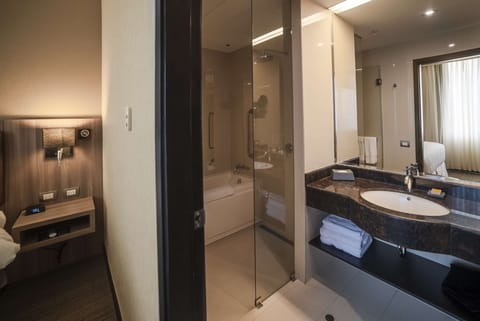 Suite, 1 King Bed, Ocean View | Bathroom | Hair dryer, towels, soap, shampoo