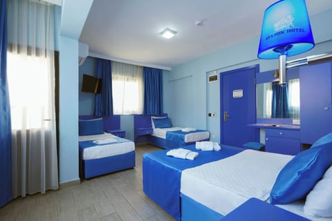 Deluxe Quadruple Room | In-room safe, desk, blackout drapes, free WiFi