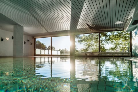 Indoor pool, pool umbrellas, sun loungers