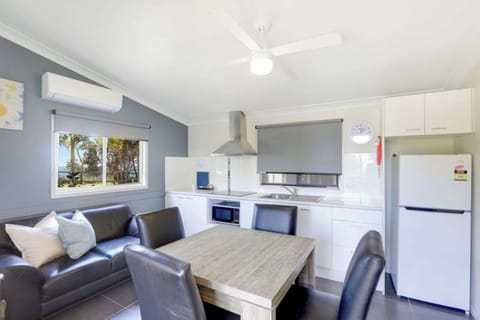 Standard Cabin - Sleeps 4 | Living area | LCD TV, pay movies