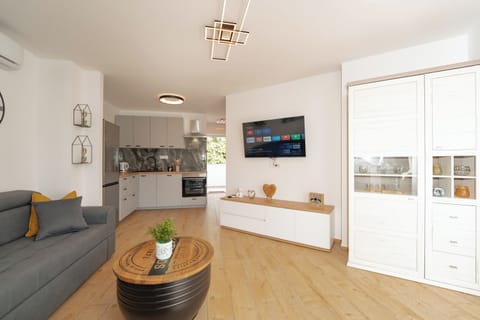 Apartment | Living area | 70-inch LCD TV with satellite channels, TV