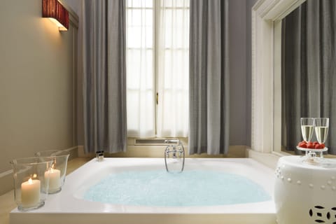 Junior Suite, Jetted Tub | Bathroom | Deep soaking tub, rainfall showerhead, designer toiletries, hair dryer