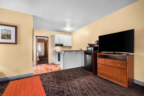 Suite, 1 King Bed, Non Smoking, Kitchenette | Desk, laptop workspace, blackout drapes, iron/ironing board