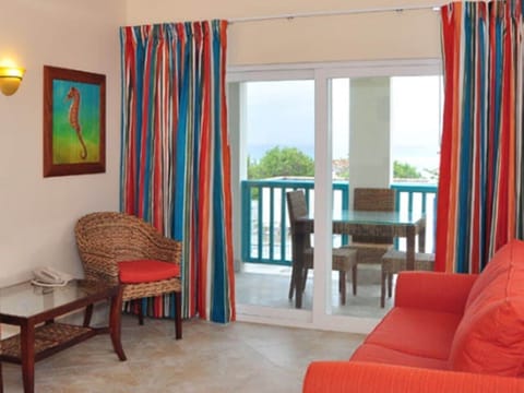 Deluxe Island View One Bedroom | Living area | Flat-screen TV