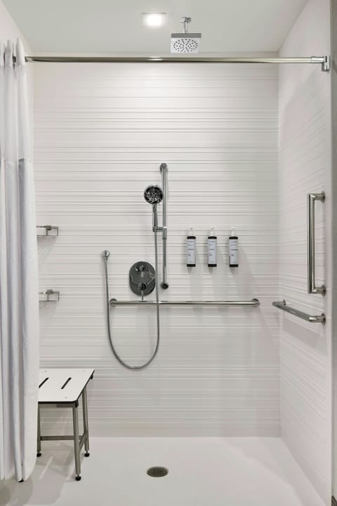 Shower, rainfall showerhead, hair dryer, towels