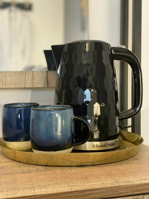 Desk, laptop workspace, blackout drapes, iron/ironing board