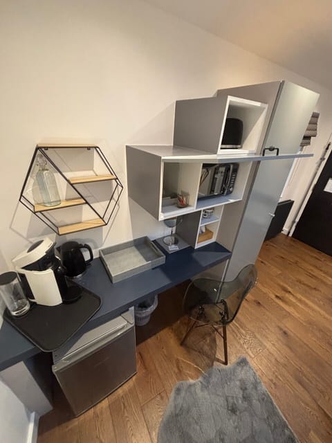 Hexagon Room | Desk, laptop workspace, blackout drapes, iron/ironing board