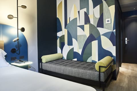 Superior Triple Room | Minibar, desk, laptop workspace, blackout drapes