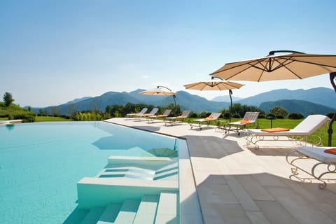 Indoor pool, seasonal outdoor pool, pool umbrellas, sun loungers