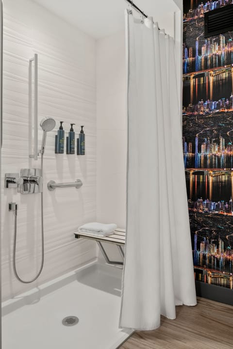 Shower, rainfall showerhead, hair dryer, towels