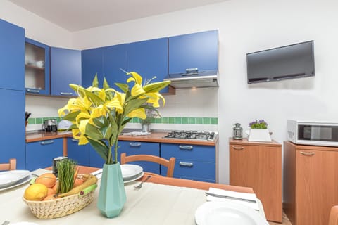 Family Apartment, 2 Bedrooms, 2 Bathrooms (Le Dimore di Nettuno 3 With Pool) | Private kitchen | Fridge, microwave, stovetop, dishwasher