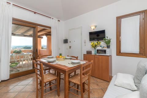 Family Apartment, 2 Bedrooms, 2 Bathrooms (Le Dimore di Nettuno 5 With Pool) | Living room | 21-inch flat-screen TV with satellite channels