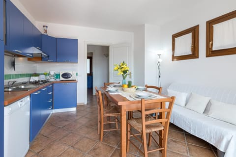 Family Apartment, 2 Bedrooms, 2 Bathrooms (Le Dimore di Nettuno 1 With Pool) | Private kitchen | Fridge, microwave, stovetop, dishwasher