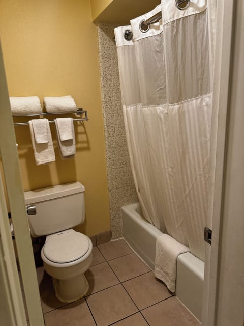 Room, 2 Queen Beds, Non Smoking | Bathroom | Combined shower/tub, free toiletries, hair dryer, towels