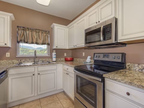 Condo, Multiple Beds, River View (#504 - No Pets Allowed) | Private kitchen | Fridge, microwave, oven, stovetop