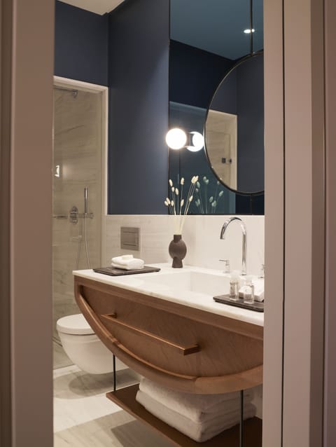 Milos Terrace Suite | Bathroom | Separate tub and shower, rainfall showerhead, designer toiletries