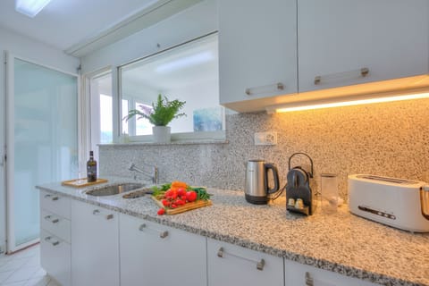 Family Apartment, 2 Bedrooms, Refrigerator & Microwave, Mountainside (Residenza Parco Carona) | Private kitchen | Fridge, microwave, oven, stovetop