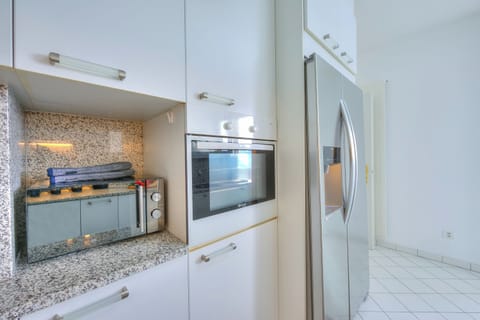 Family Apartment, 2 Bedrooms, Refrigerator & Microwave, Mountainside (Residenza Parco Carona) | Private kitchen | Fridge, microwave, oven, stovetop
