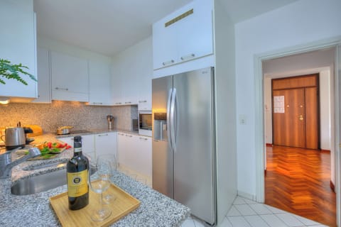 Family Apartment, 2 Bedrooms, Refrigerator & Microwave, Mountainside (Residenza Parco Carona) | Private kitchen | Fridge, microwave, oven, stovetop