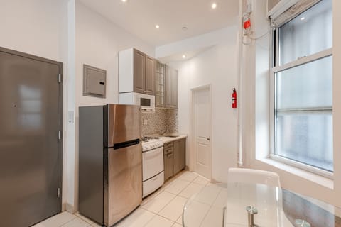 Apartment | Private kitchen | Full-size fridge, microwave, oven, stovetop