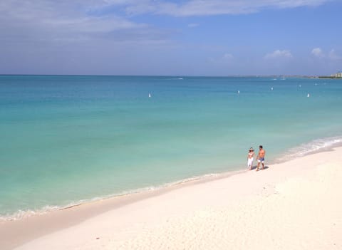 Beach nearby, white sand, beach towels