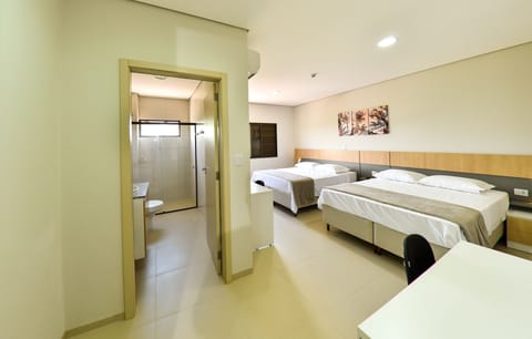 Family Room, Multiple Beds | Minibar, desk, laptop workspace, free WiFi