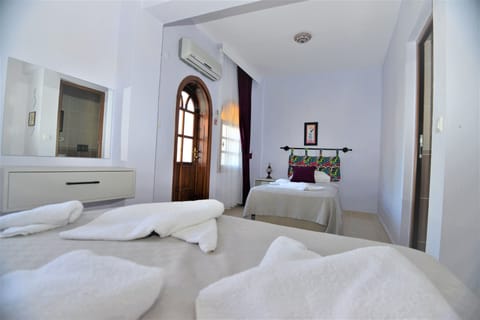 Superior Triple Room, Balcony | Minibar, individually furnished, free WiFi, bed sheets