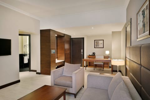 Executive Suite, 1 King Bed | Living room | 40-inch LCD TV with satellite channels, TV, iPod dock