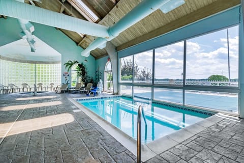 Indoor pool, outdoor pool, open 9 AM to 11 PM, sun loungers