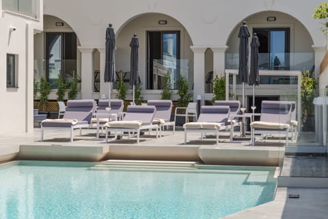 Seasonal outdoor pool, pool umbrellas, sun loungers