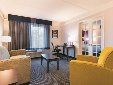 Suite, 1 King Bed, Non Smoking | Premium bedding, desk, laptop workspace, iron/ironing board