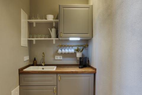 Condo | Private kitchen | Stovetop, electric kettle, toaster, cookware/dishes/utensils