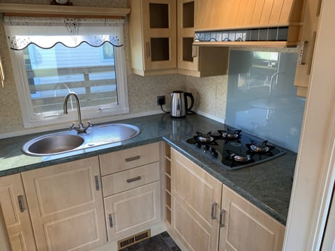 Cabin | Private kitchen | Fridge, microwave, oven, stovetop