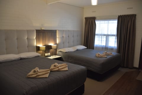 Quadruple Room | Blackout drapes, iron/ironing board, free WiFi, bed sheets