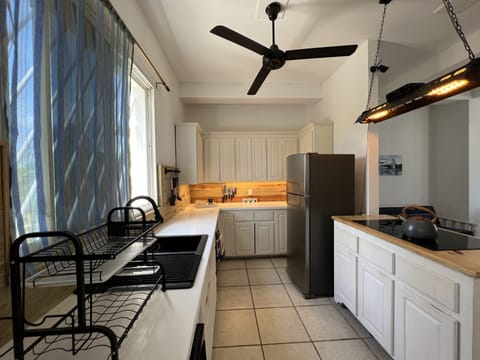 Blue Hole, Deluxe Apartment | Private kitchen | Fridge, microwave, coffee/tea maker, electric kettle